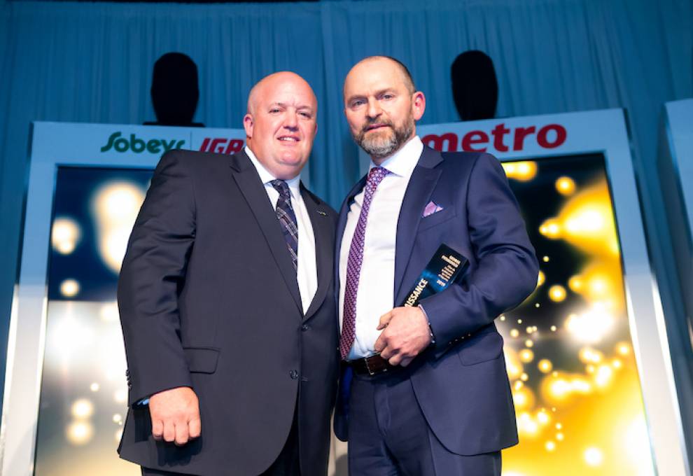 Dino Farrese (L), 2018-2019 QPMA president presents Pillar of the Industry award to George Pitsikoulis