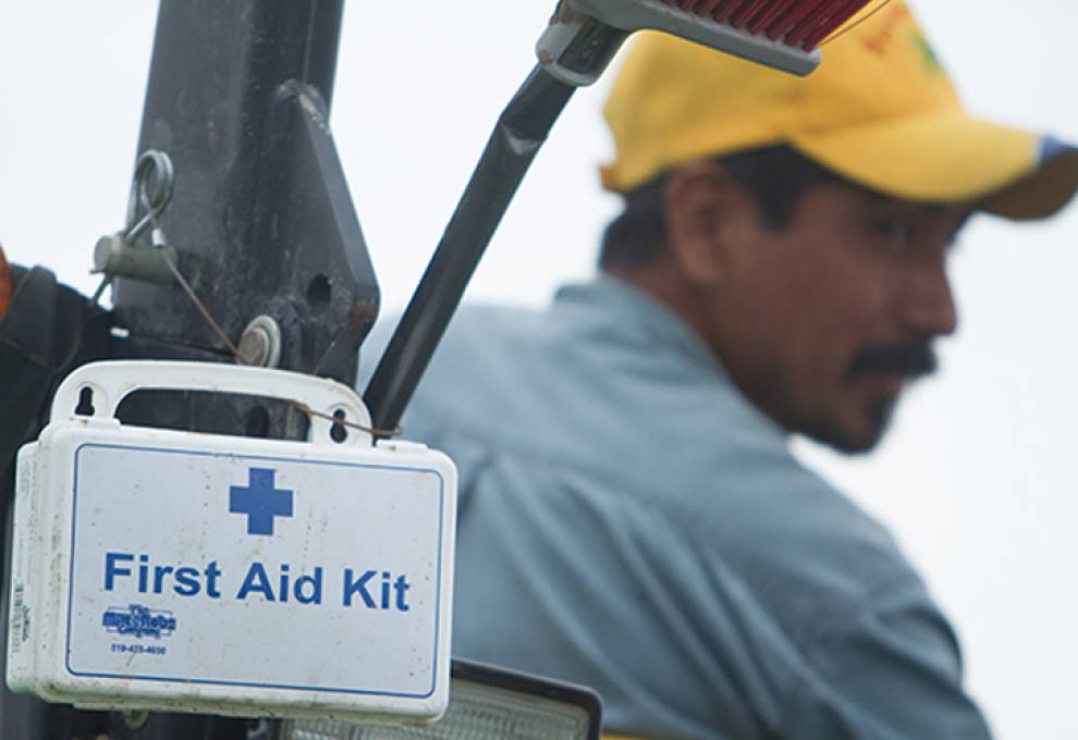 Worker and first aid kit