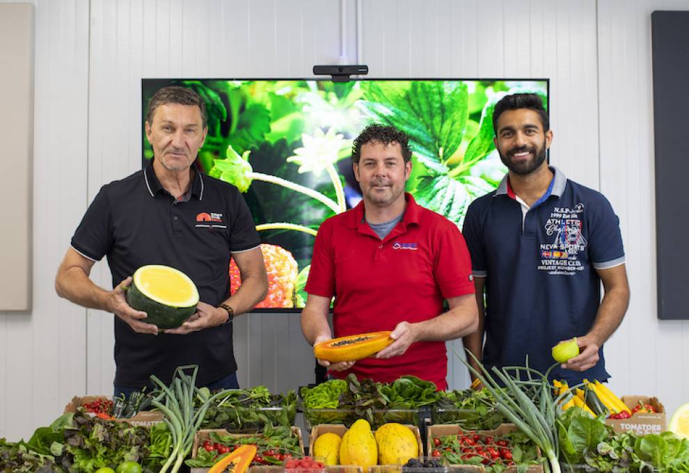 This cornucopia of fruits and vegetables represents a two-day harvest of everything grown in a R & D greenhouse at Leamington, Ontario. Peter Quiring, (L) owner of South Essex Fabricating and Nature Fresh Farms is pictured with head grower Matt Korpan and assistant grower Punit Singh. The grower team harvested the first winter-grown peaches in Canada in January 2023.
