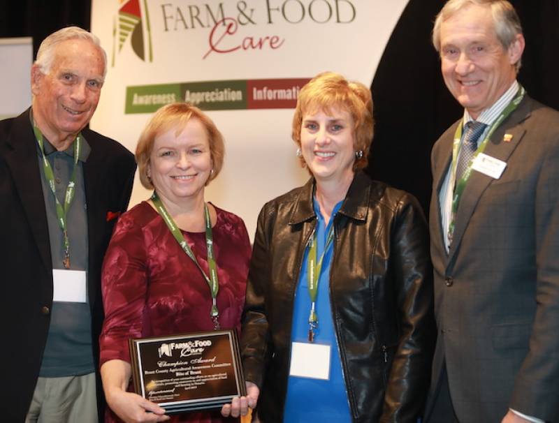 The Brant County Agricultural Awareness Committee was awarded the Farm & Food Care Champion Award for 2019. Farm & Food Care past chair Bruce Christie (left) and current board member Crispin Colvin (right) presented the award to committee members Barbara Sheardown and Jayne Miller.