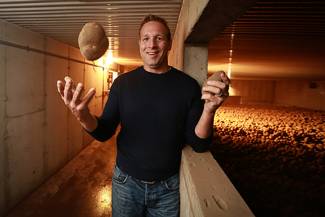 Fourth-generation potato grower Trevor Downey is proud of the quality potatoes going into cold storage near Shelburne, Ontario.