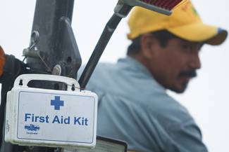 Worker and first aid kit