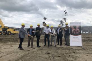 From left: Dennis Haan of Eagle Builders LP, Scott Hine of The Little Potato Company, Sanford Gleddie of The Little Potato Company, Frank Santiago of the Little Potato Company, CEO Angela Santiago, Cameron Naqvi of Cameron Development Corp., and Matt Woolsley of York Reality, broke ground on the future site of the Little Potato Company's new packaging facility in Nisku, June 28.