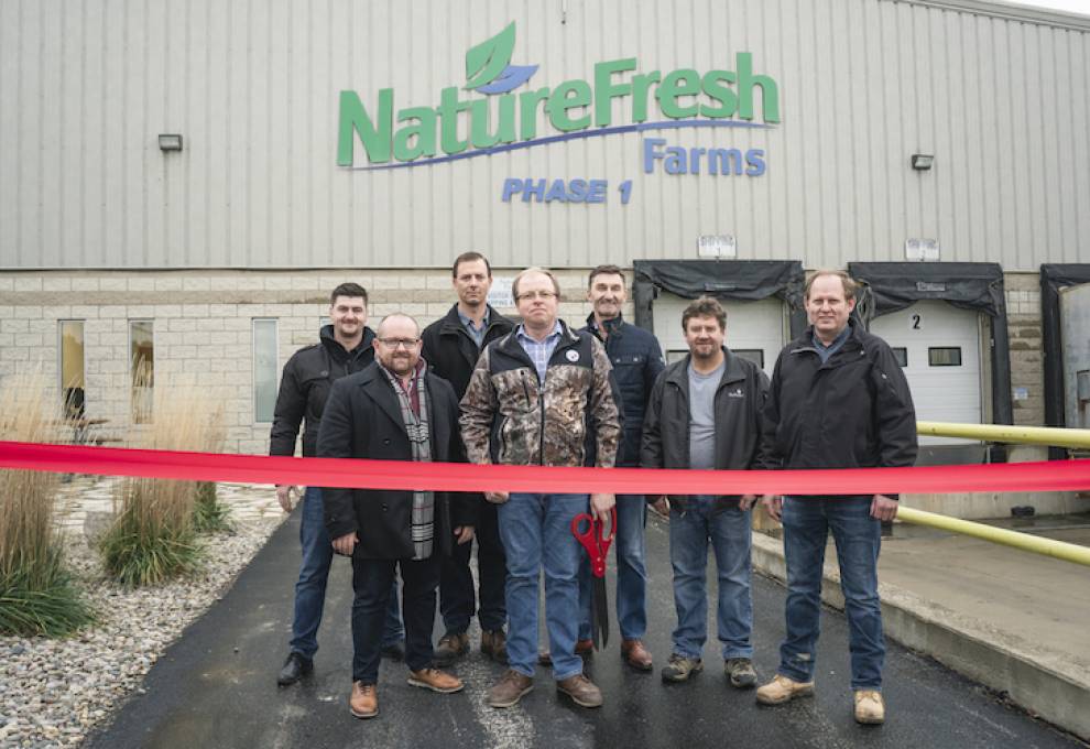 Founder and owner of Nature Fresh Farms, Peter Quiring; general manager, John Ketler; and executive retail sales account manager, Matt Quiring cut the ribbon along with their new partners: Neil Enns, Ben Friesen, Abram Fehr, and Peter Klassen.