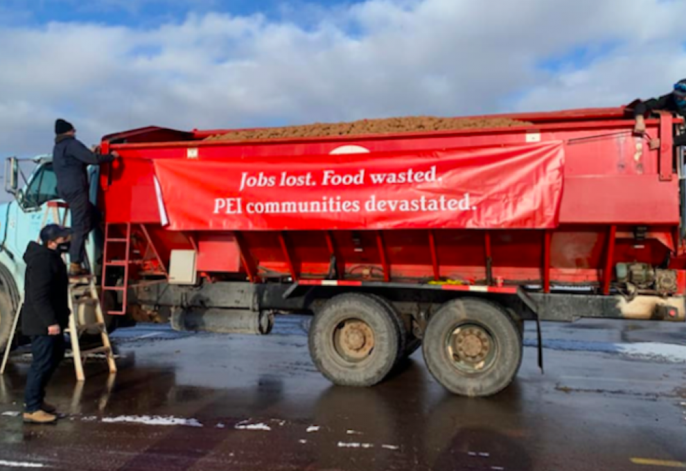 In late December 2021, a truck convoy in downtown Charlottetown carried a protest message about the PEI border closure to potato exports to the United States.