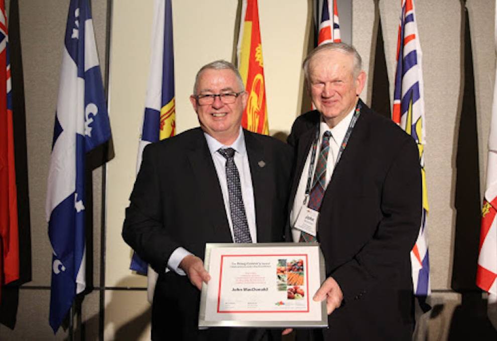 John MacDonald, (R) receives the Doug Connery Award from outgoing president, Alvin Keenan.